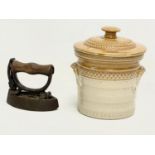 A vintage stoneware jar with lid and a small iron. Jar measures 14x16cm