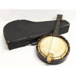 An early 20th century banjolele by Bell-Tone in case.