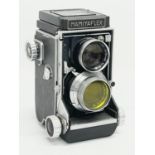 A Mamiyaflex C camera with Mamiya-Sekor lens.