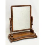 A Victorian mahogany dressing mirror. 60x26x69cm.