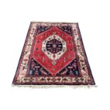 A large vintage Middle Eastern hand knotted rug. 288x187cm