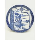 A large early 20th century Japanese blue and white pottery charger. 31.5cm