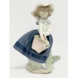 A Lladro figurine ‘Pretty Pickings’ 18cm.