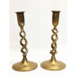 A pair of ornate Victorian brass candlesticks. 21cm