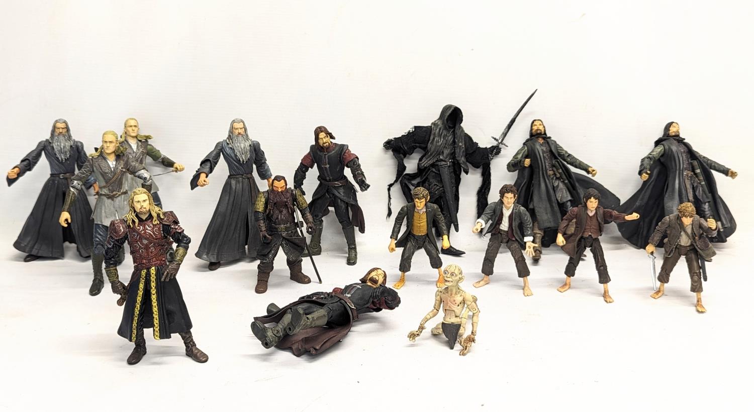 A collection of The Lord of The Rings toy figures by Marvel, including Aragorn, Gandalf, Boromir,