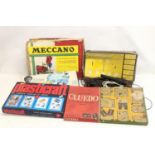 A quantity of vintage games with a vintage Meccano set.