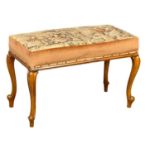 A Victorian walnut window bench on cabriole legs with tapestry seat. 97x47x62cm