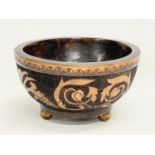 An early 20th century wooden Pokerwork bowl on brass feet. 19.5x11cm