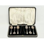 Sterling silver spoons and tongs in case. Birmingham. Case measures 23x15cm.