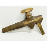 A large late 19th/early 20th century Irish brass keg tap. 20x15cm