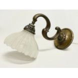 A vintage brass wall lighting fitting with glass shade. 36cm