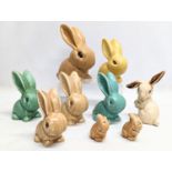 A quantity of 9 Sylvac pottery rabbit figures, including a pair of Sylvac pottery salt and pepper