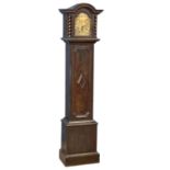 An early 20th century oak long case clock with brass face by Tempus Fugit, in the Jacobean style.
