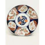 A large late 19th century Japanese Imari pattern charger and bowl. Charger measures 36.5cm