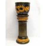 A West German Mid Century pottery jardiniere on stand. 62.5cm