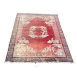 A large vintage Middle Eastern hand knotted rug. 205x297cm