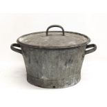 A vintage galvanized two handled basin with lid. 49x34cm