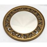 A vintage ornate gilt framed bevelled mirror. 51cm