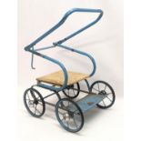 A vintage Tri-Ang dolls pram.