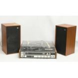 A vintage Sanyo G2711-Super music record cassette player with a pair of teak Wharfedale speakers.