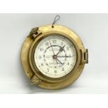 A brass ships clock. 19cm