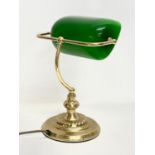 A brass desk lamp with glass shade. 28x35cm.