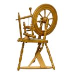 A vintage spinning wheel. 70x104cm