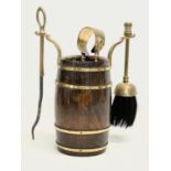 A vintage oak brass bound companion set.