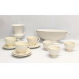 A quantity of Wedgwood Pottery teacups and saucers with Wedgewood pottery vase and Spode pottery