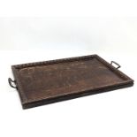 An early 20th century oak serving tray. 57.5x36cm