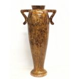 A large early 20th century wooden vase. 70cm