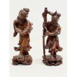 A pair of vintage Chinese teak fisherman figures. 21cm.
