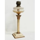 A large Victorian onyx and brass oil lamp with Corinthian style pillar. 56cm
