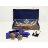 A vintage Scottish Master Masonic apron, sash and medal in original leather case.