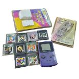 A Game Boy, with games and accessories