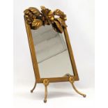 An ornate gilt brass mirror. 22.5x38.5cm