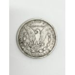 An 1883 USA silver dollar.