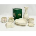 A quantity of Belleek pottery. Largest vase measures 21cm.