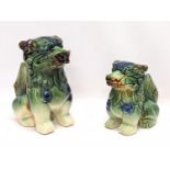 A pair of Chinese pottery Foo Dogs. Largest measures 19.5cm