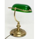 A brass desk lamp with glass shade. 28x35cm