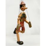 A large vintage wooden Pinocchio puppet 65cm.