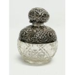A sterling silver perfume bottle. 8x10cm