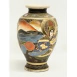 An early 20th century Japanese Satsuma pottery vase. 16x25cm