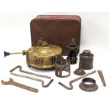 A vintage brass Primus stove and parts.