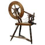 A vintage spinning wheel. 70x104cm