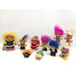 A collection of vintage Troll Dolls.