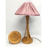 A vintage Irish Beech table lamp by Austin Wood Design with wall clock.