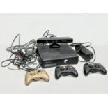 An XBOX 360 console with a Kinect, 3 controllers and leads.