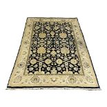 A large vintage hand knotted rug. 182x287cm