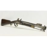 An 18th century Blunderbust rifle with steel barrel and spring bayonet. Made in York for the Irish